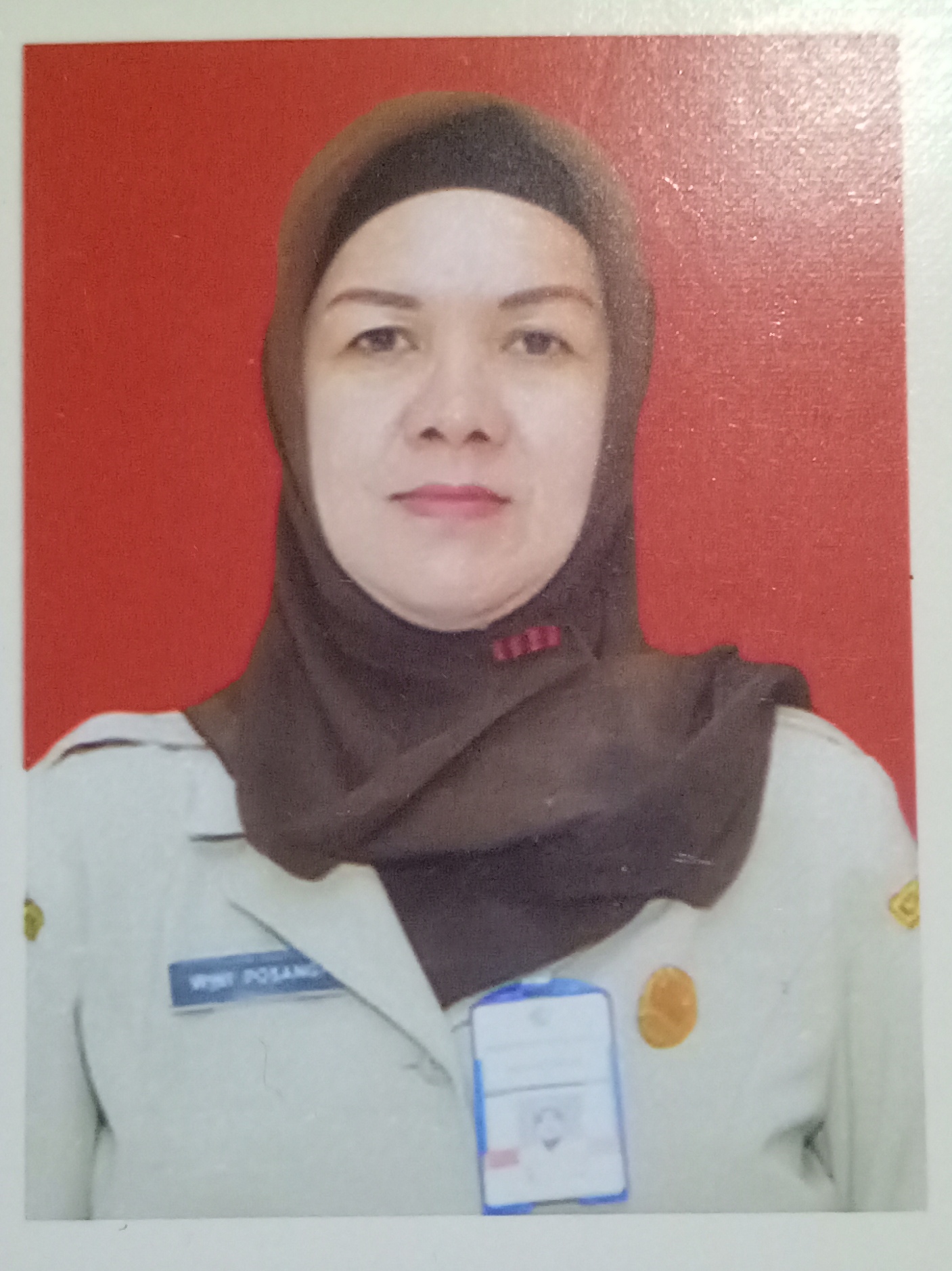 WIWI POSANGI, S.Pd.