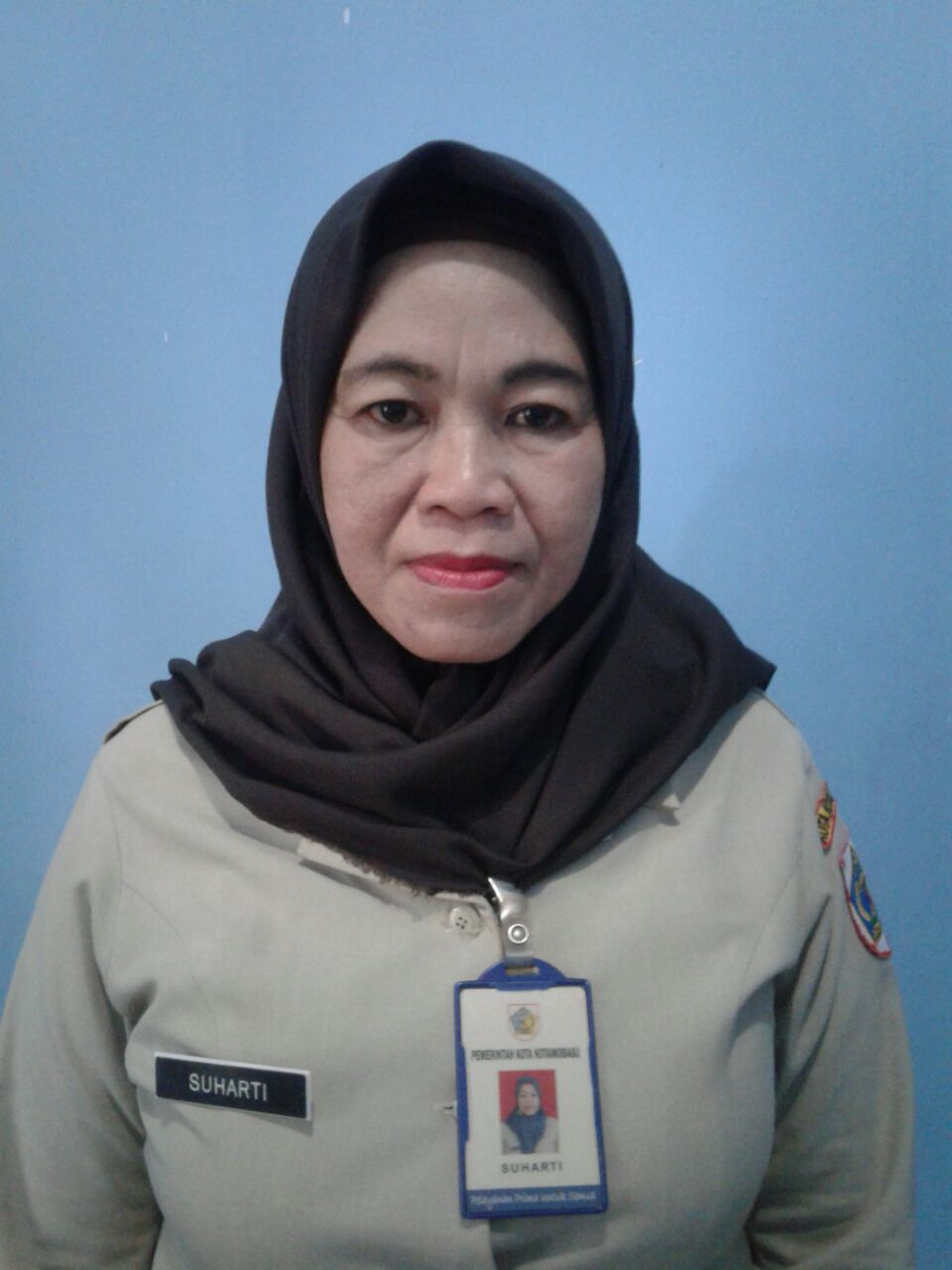 SUHARTI PASAMBUNA, S.E.