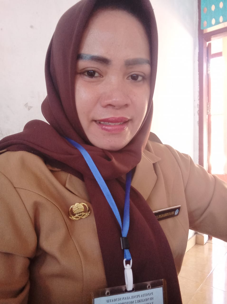 DINA MARIANA MOKOAGOW, S.Pd.