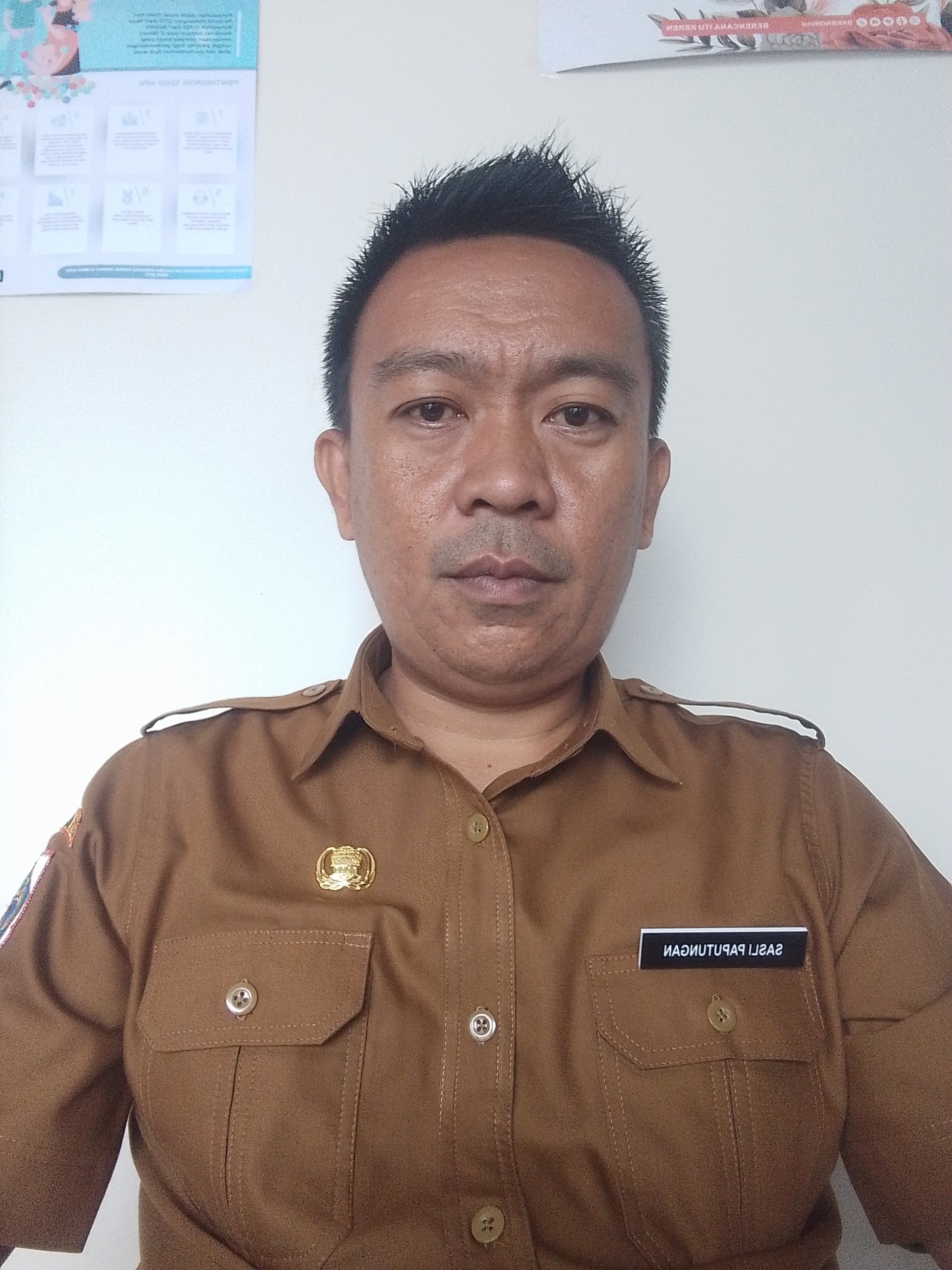 Sasli Paputungan, S.IP