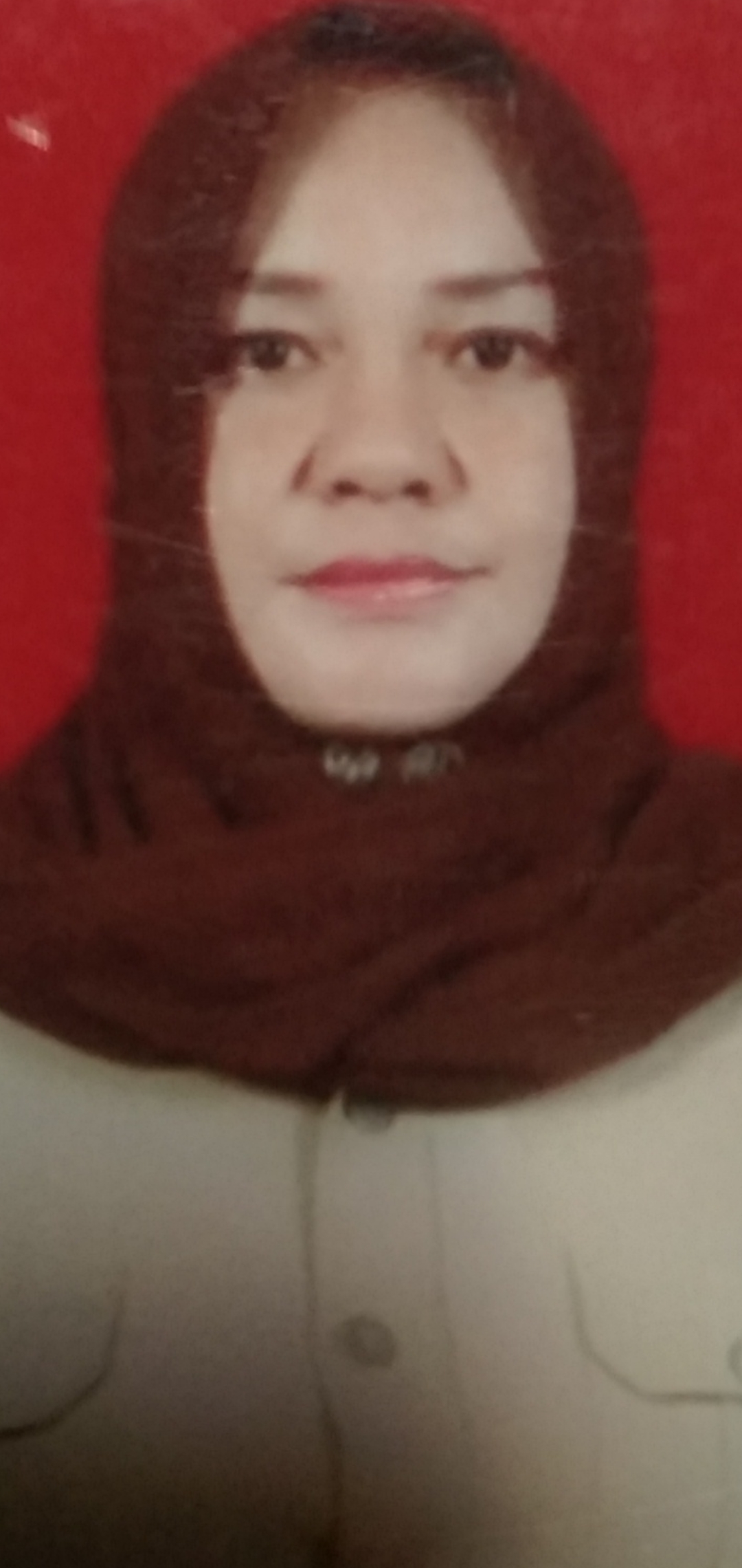 YANI MOKODOMPIT, S.E.