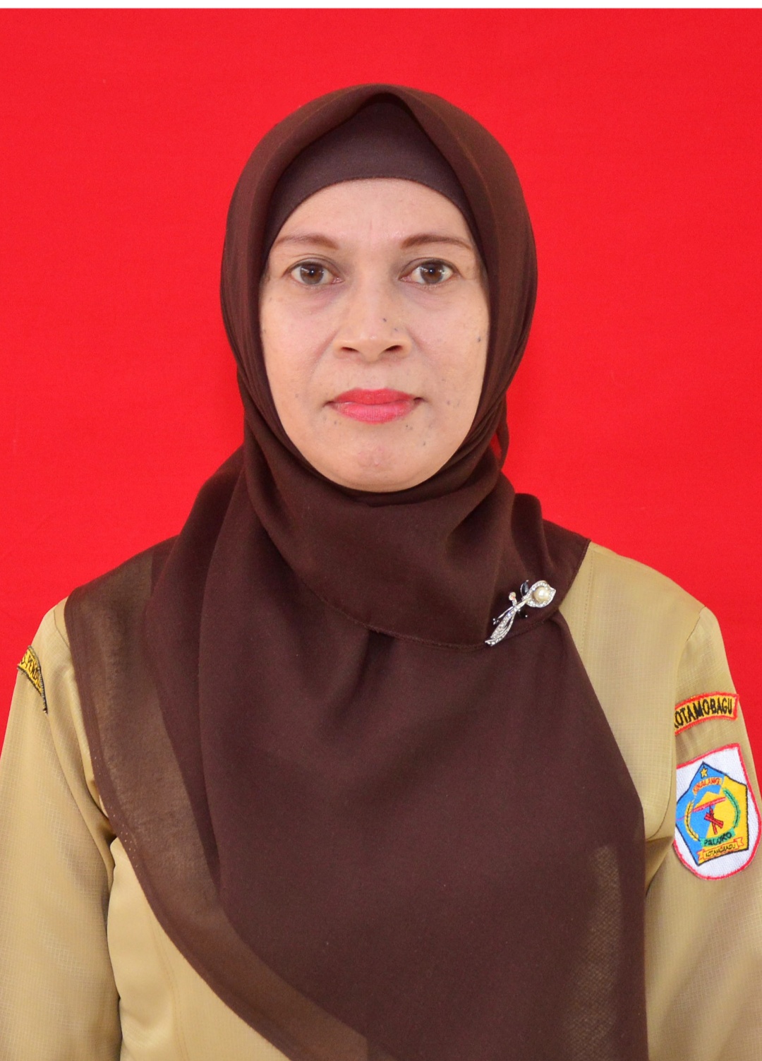 ALMA HARFIAH MOKOGINTA, S.Pd.